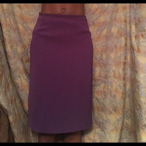 A plum purple skirt 
Around Knee length